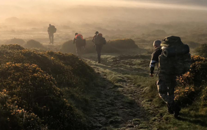 Soldiers on a walking exercise, carrying backpacks up a misty mountain. As seen on the MK Mortgages, Armed Forces Mortgages page