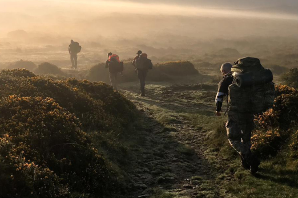 Soldiers on a walking exercise, carrying backpacks up a misty mountain. As seen on the MK Mortgages, Armed Forces Mortgages page