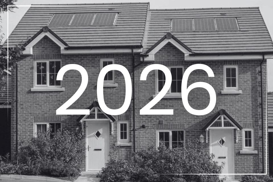 A terraced house in black and white, with 2026 overlayed.